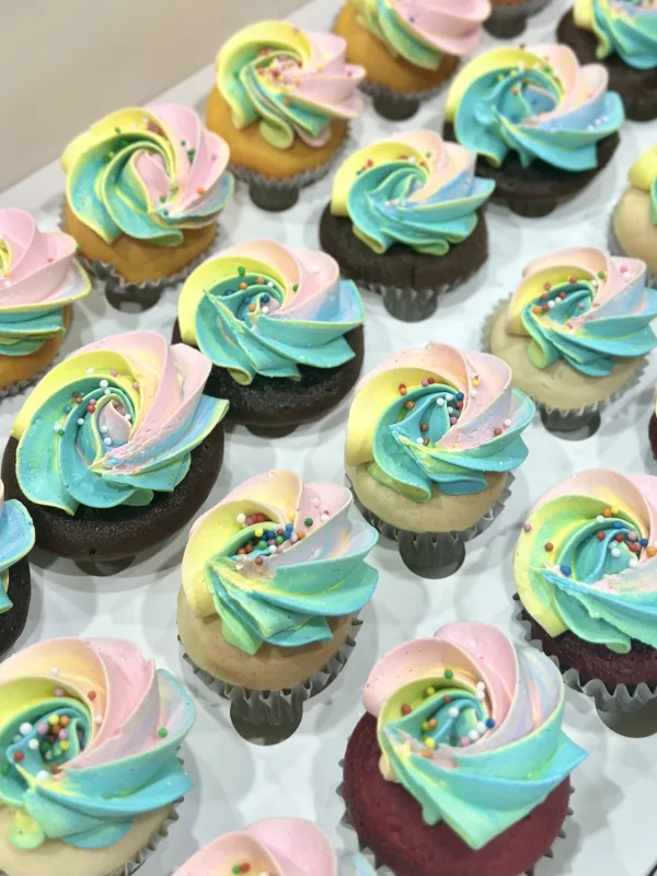 Exquisitely Piped Rainbow Swirl Cupcakes